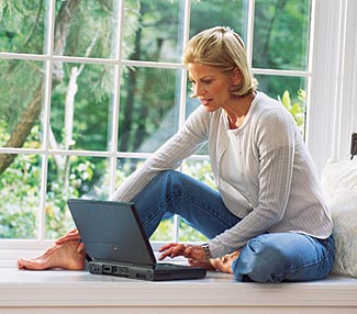 Female teacher sitting in front of a laptop